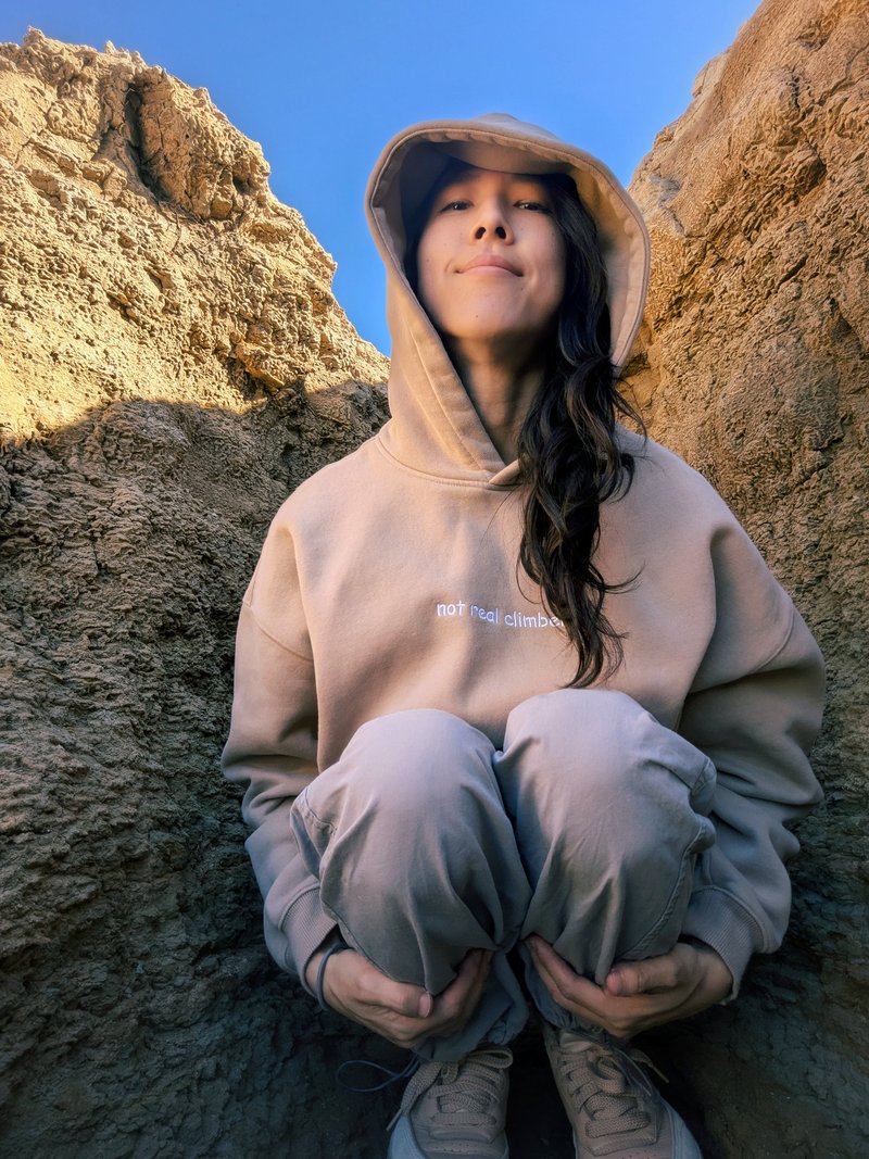 Beige oversized fleece hoodie — sleeve logo tag